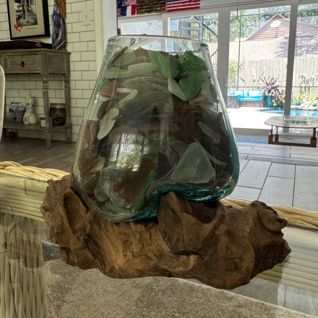 sew glass in sculpture on wood